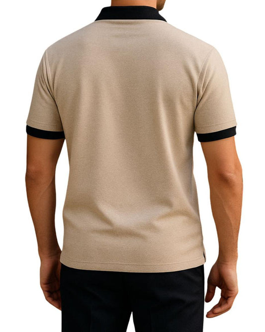 Beige polo shirt with black trim on a white background
